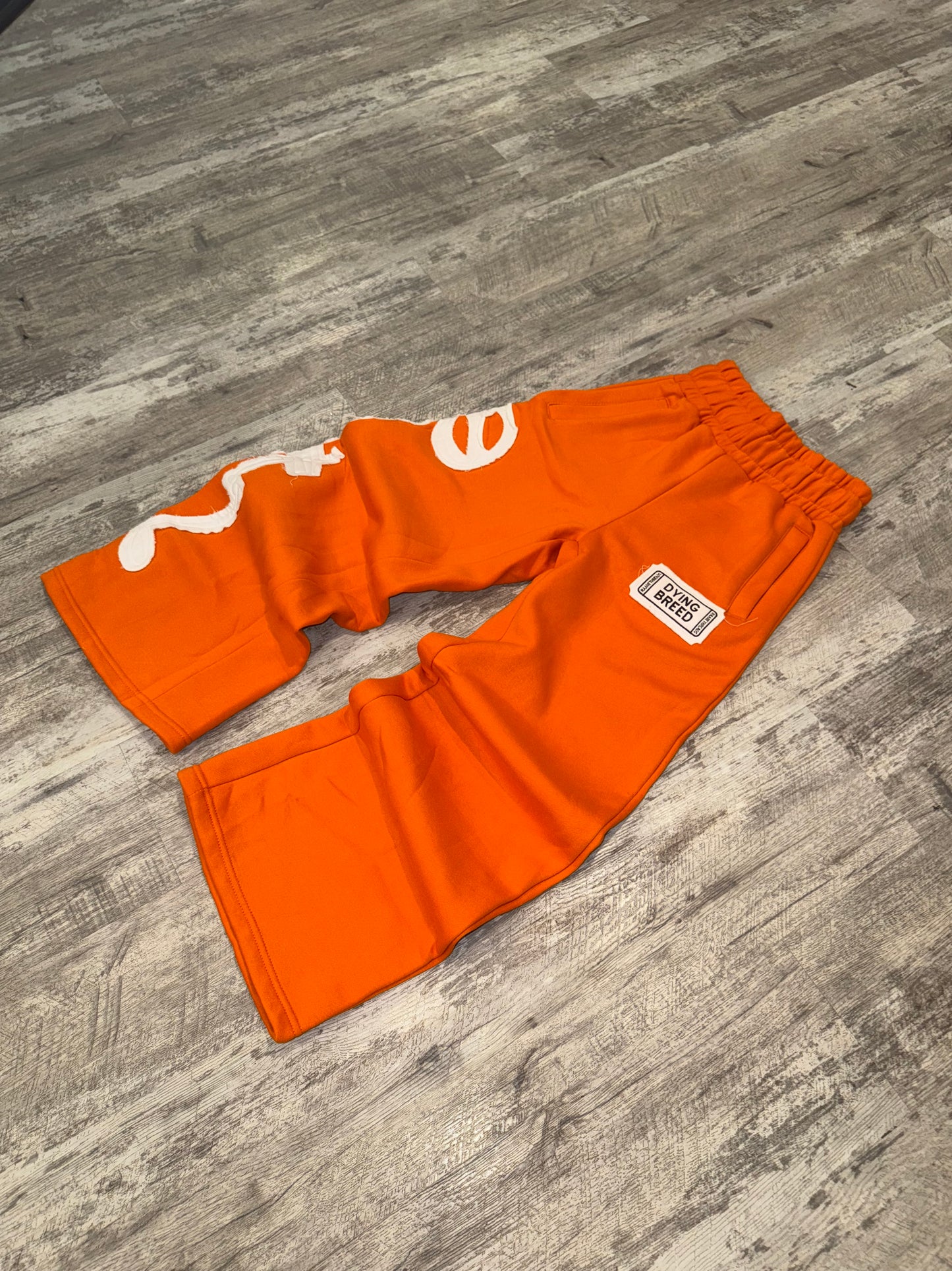 “DYING BREED" ORANGE SWEATPANTS