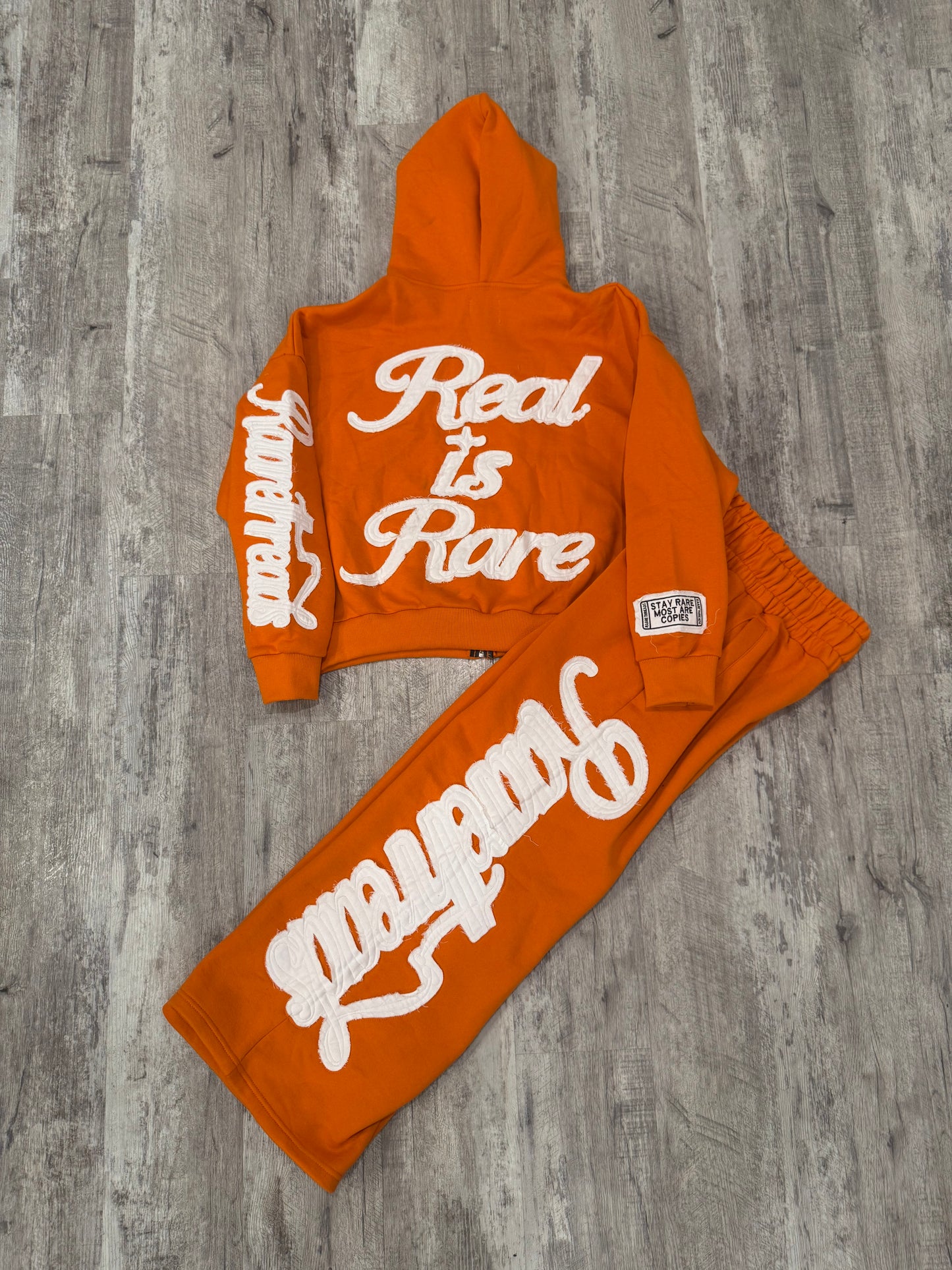 “STAY RARE MOST ARE COPIES“ ORANGE JACKET
