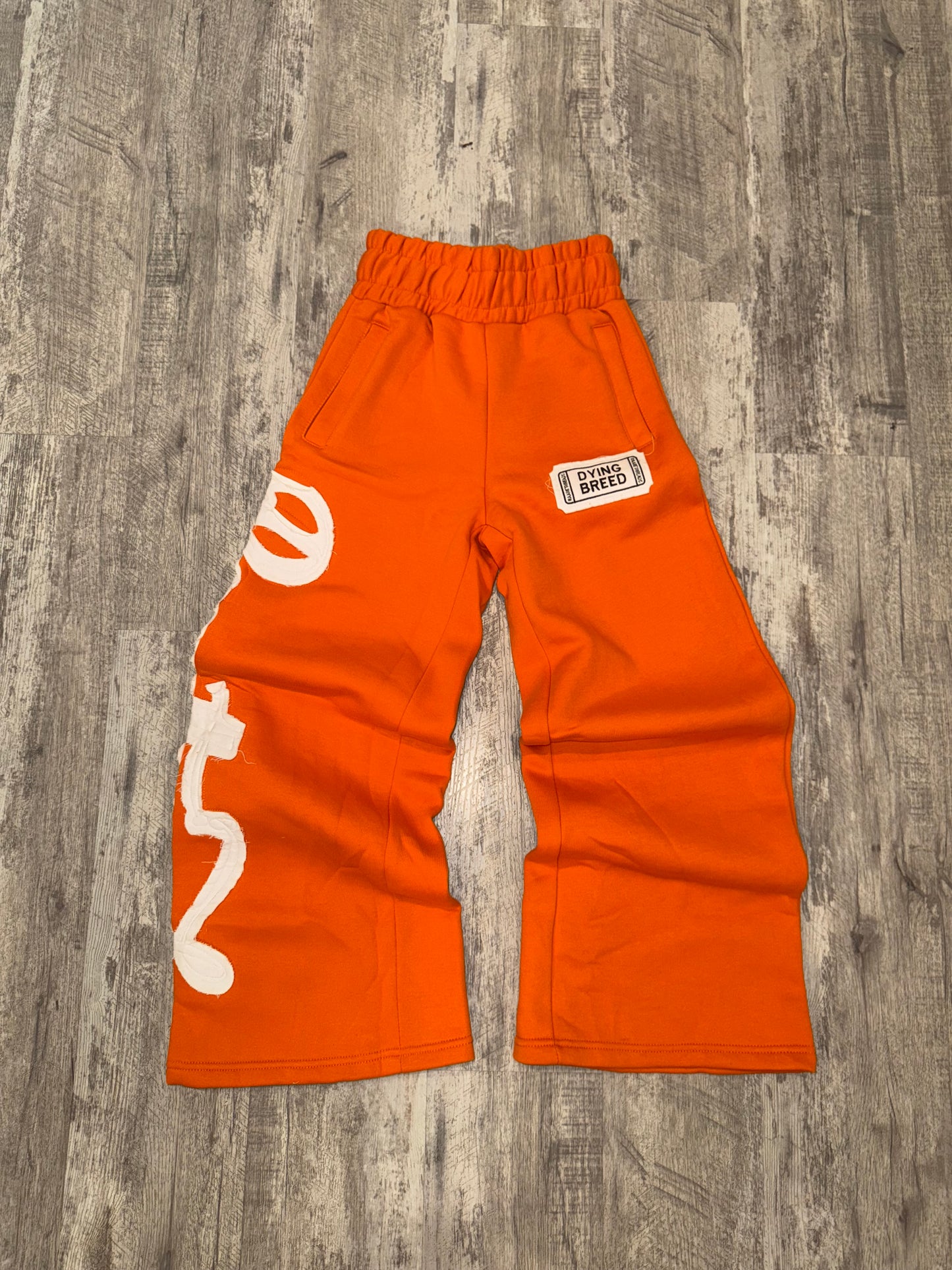 “DYING BREED" ORANGE SWEATPANTS