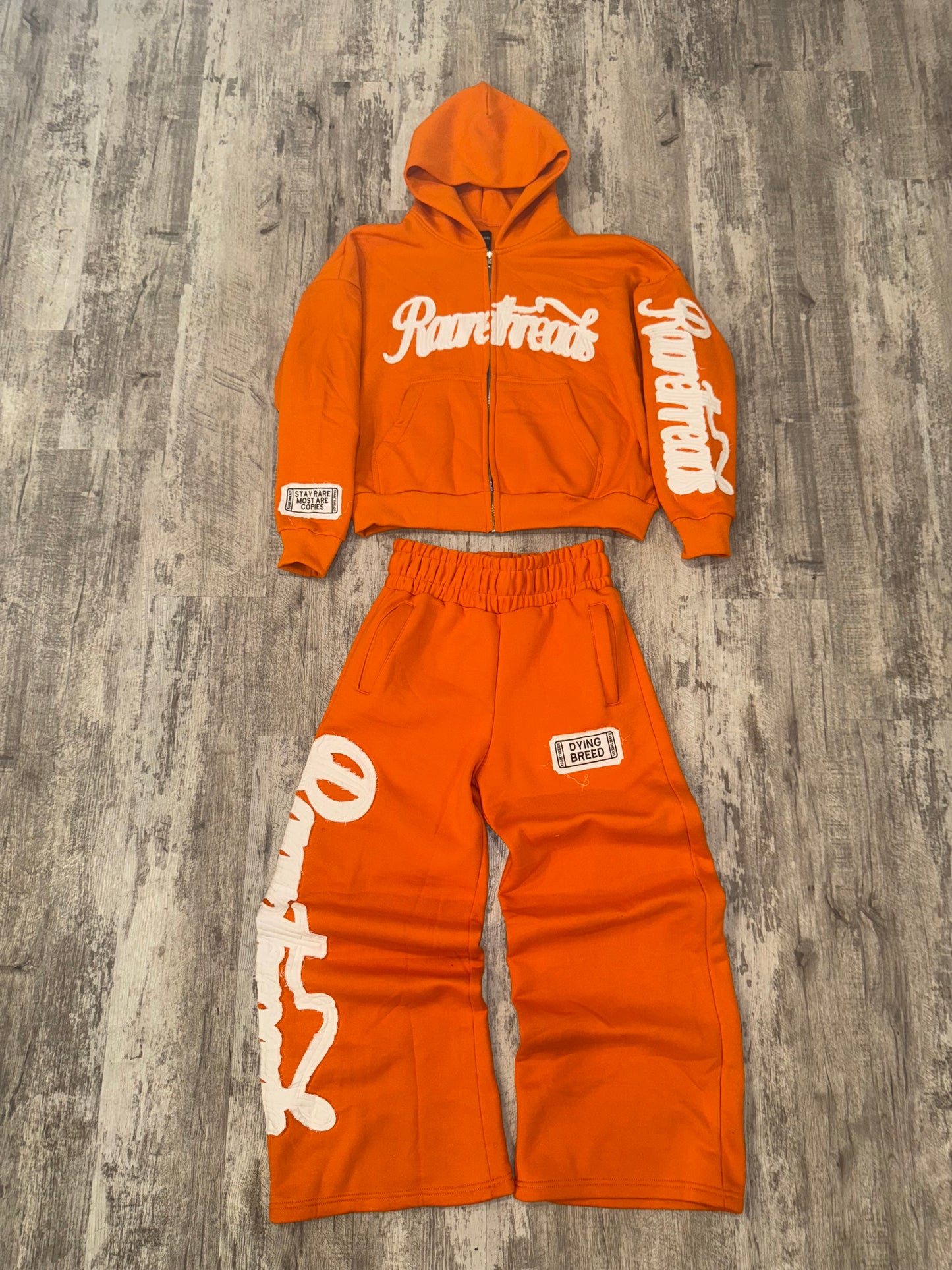 “STAY RARE MOST ARE COPIES“ ORANGE JACKET