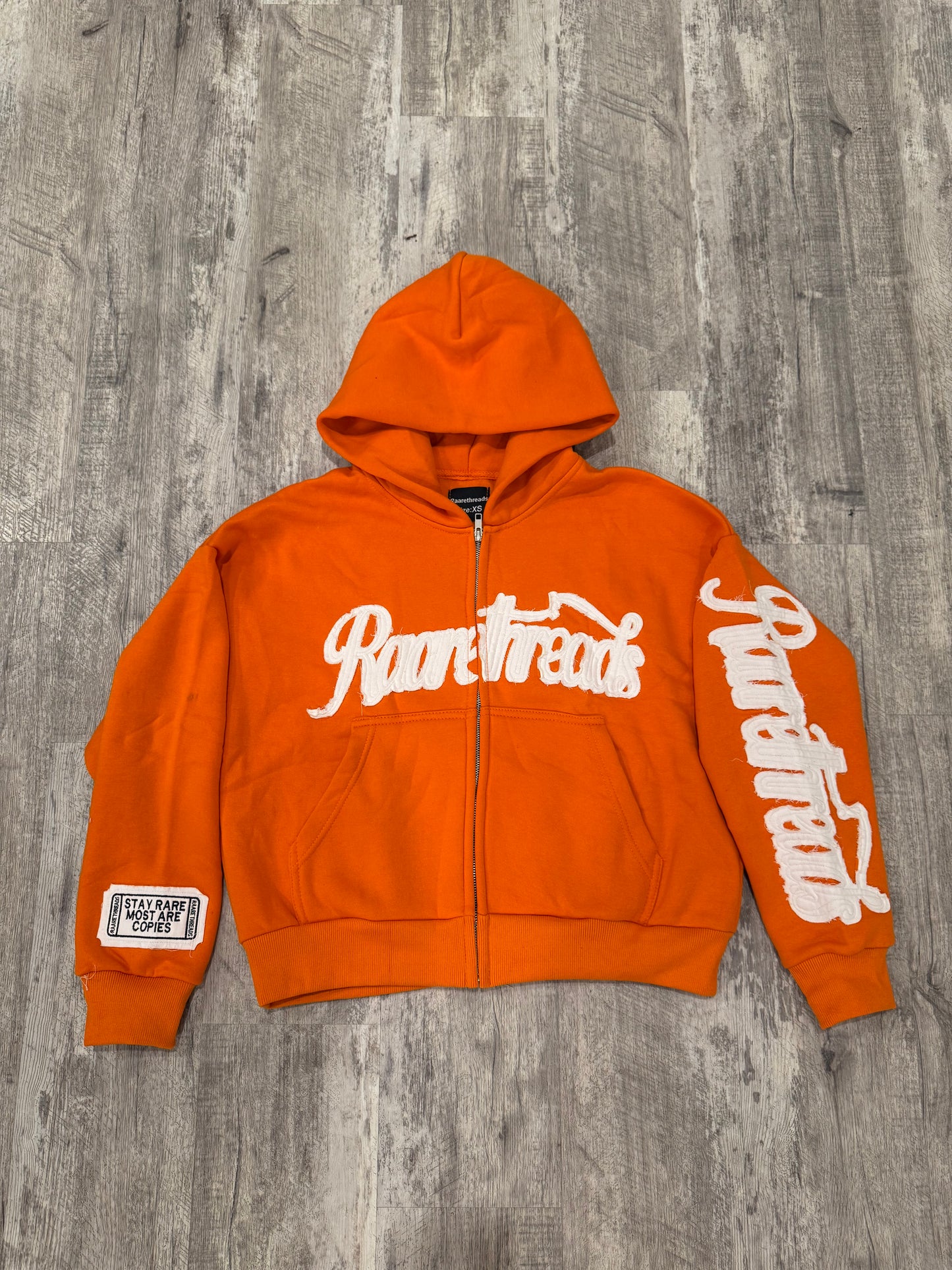 “STAY RARE MOST ARE COPIES“ ORANGE JACKET